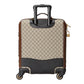 Patterned suitcase with black handle and base on a light gray background