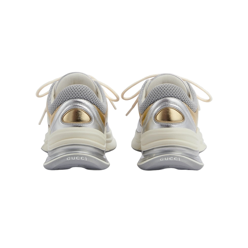 Pair of Gucci sneakers on a light gray background