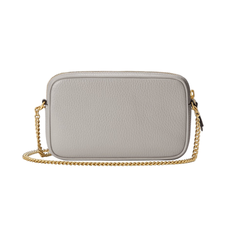 Gray handbag with a gold chain on a light gray background