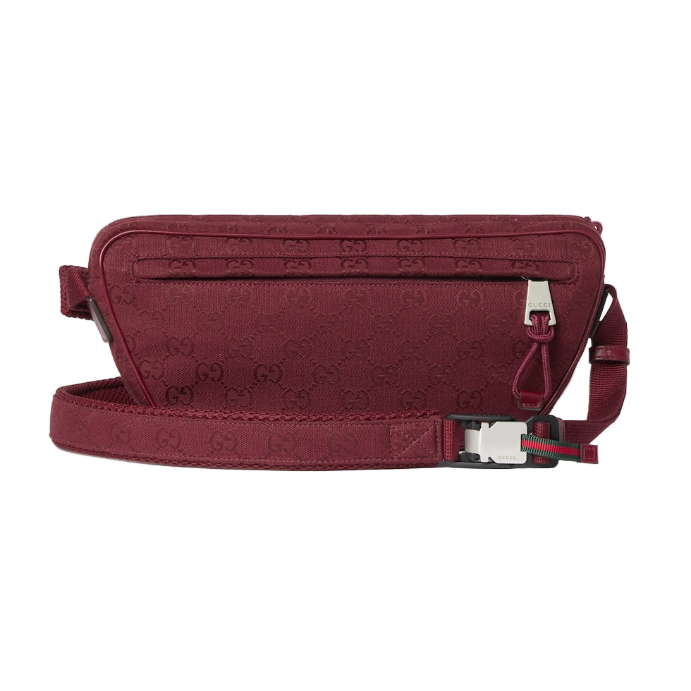 Red crossbody bag with brand logo on a light gray background