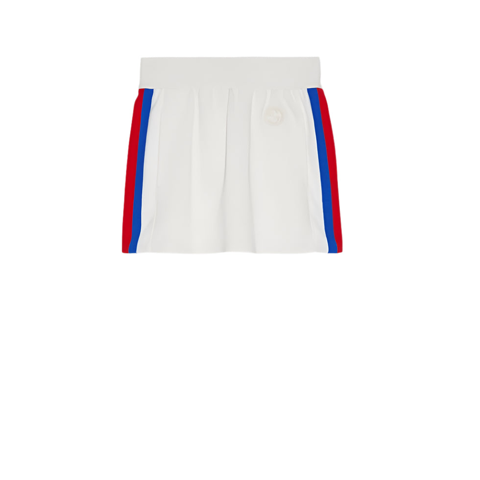 White Gucci mini skirt with red and blue stripes on a light gray background