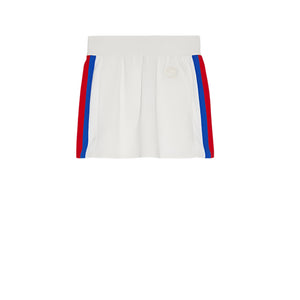 White Gucci mini skirt with red and blue stripes on a light gray background