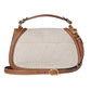 Handbag with beige canvas body and brown leather straps on a light gray background
