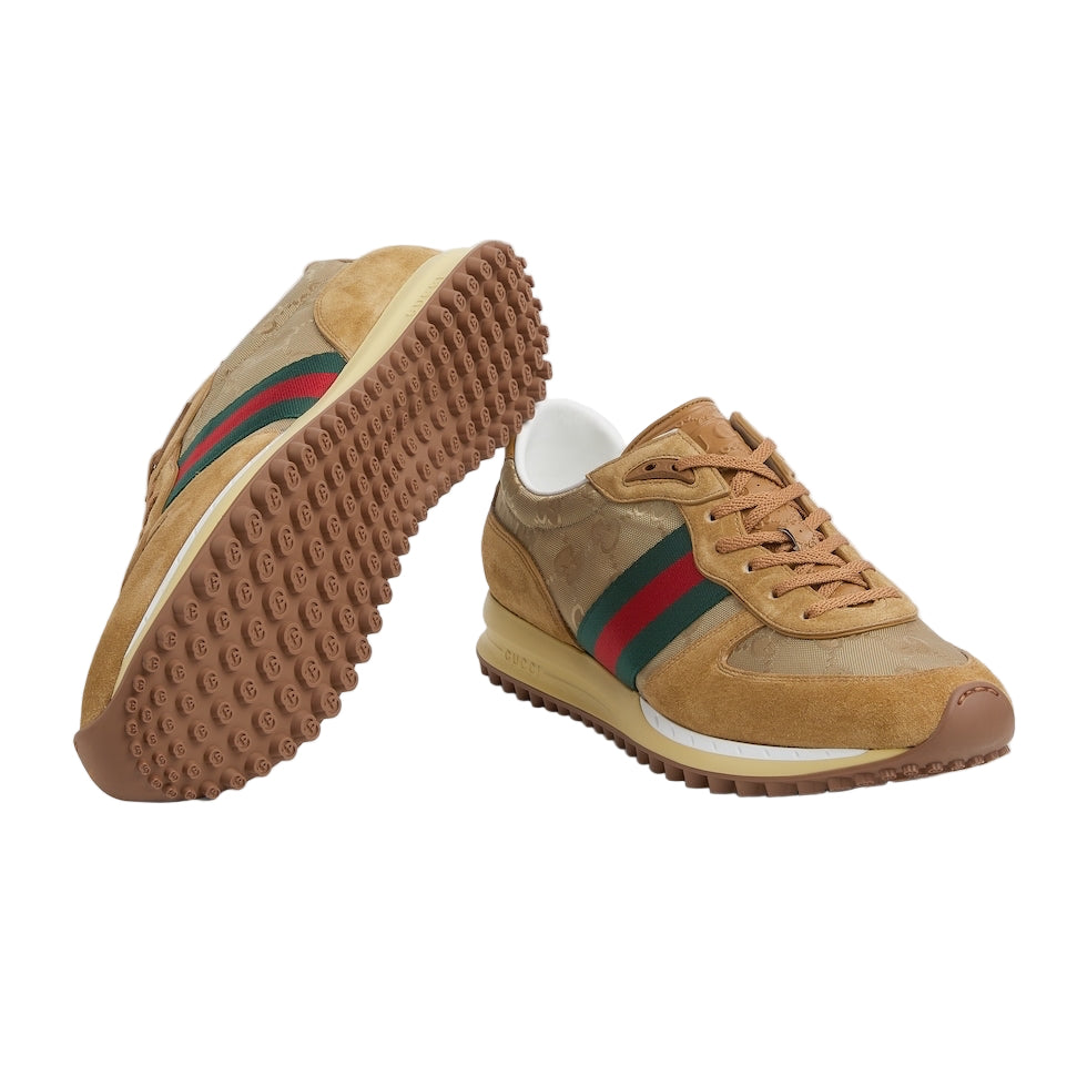 Tan sneakers with green and red stripes on a light gray background