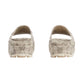 Pair of snake print shoes on a light gray background