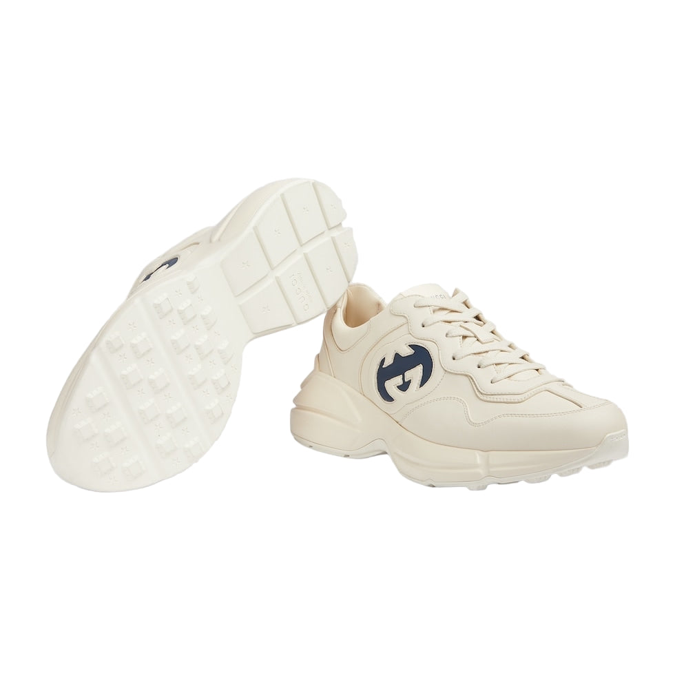 White sneakers with a logo on a light gray background