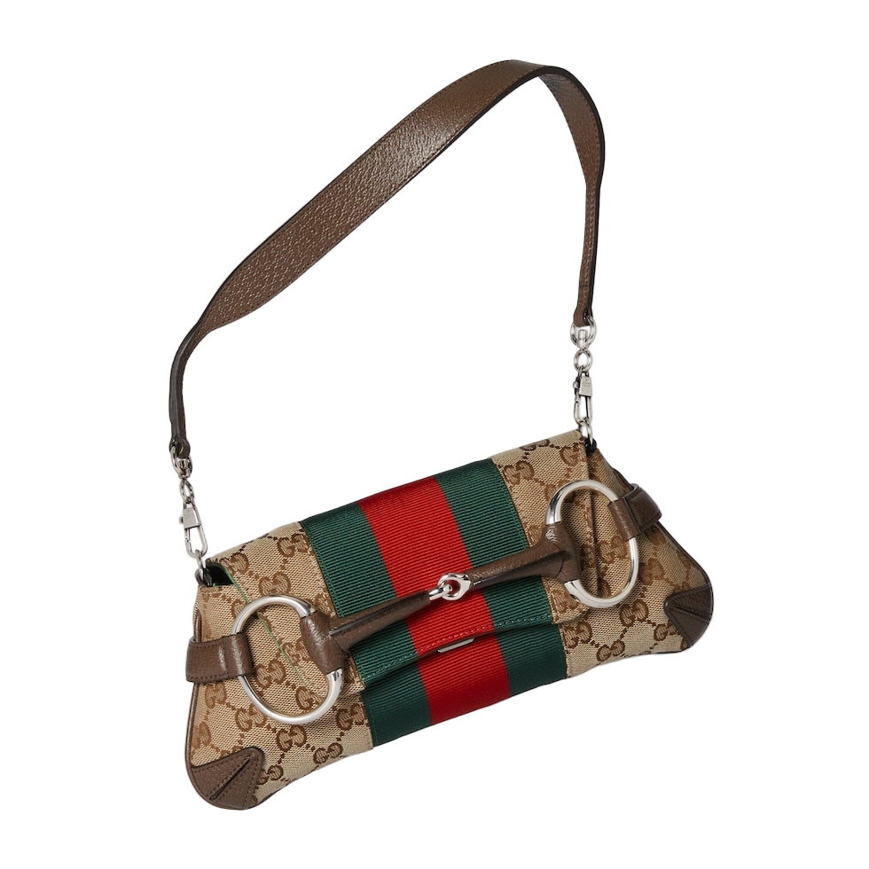 Designer handbag with brown strap and red, green, and beige stripes on a light gray background
