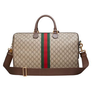 Designer handbag with GG pattern and red and green stripe on a light gray background