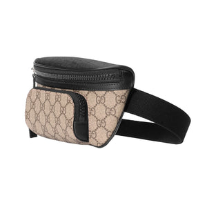 Beige and black waist bag with Gucci logo on a light gray background
