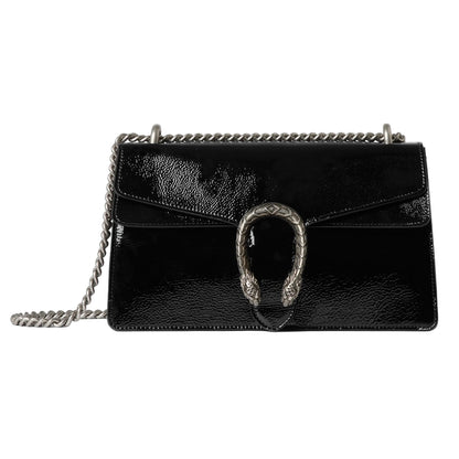Black leather handbag with chain strap on a light gray background