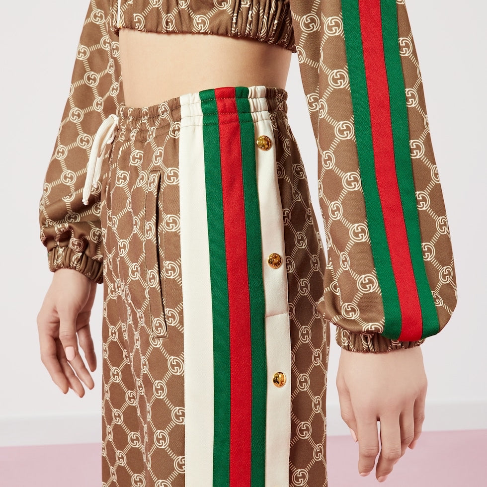 Brown patterned outfit with red and green stripes on a white background
