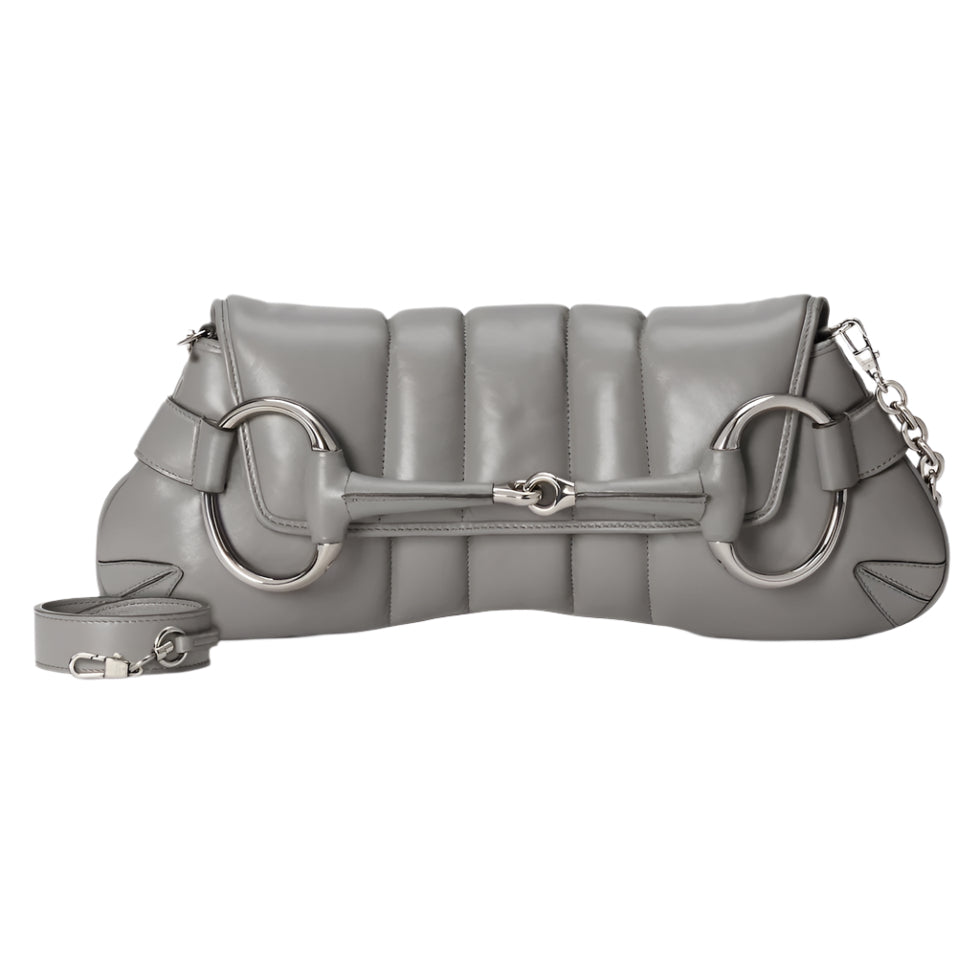 Gray quilted Gucci Horsebit handbag with chain detail on a light gray background