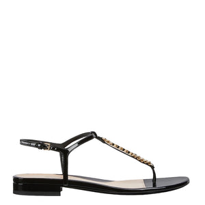 Black Gucci sandal with gold chain detail on a white background