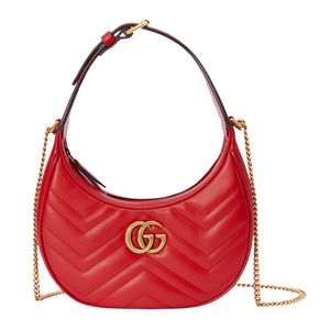 Red handbag with gold chain and logo on a light gray background