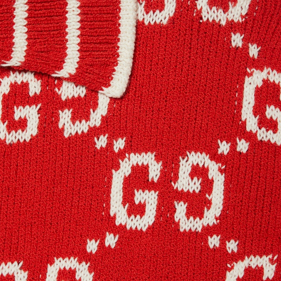 Close-up of red fabric with white letter 'GG' pattern