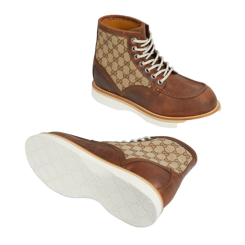 Brown high-top sneakers with Gucci logo pattern on a light gray background