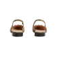 Pair of cork sandals on a light gray background