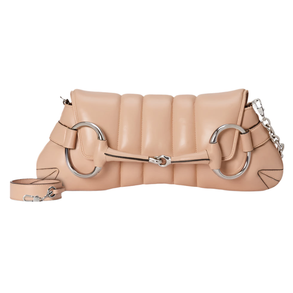 Beige Gucci Horsebit handbag with metallic ring design on a light gray background