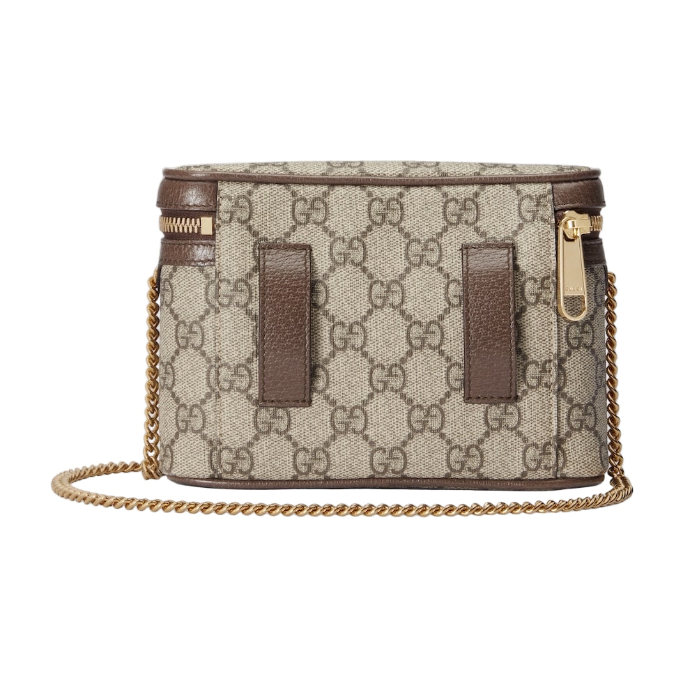 Designer handbag with chain strap on a light gray background