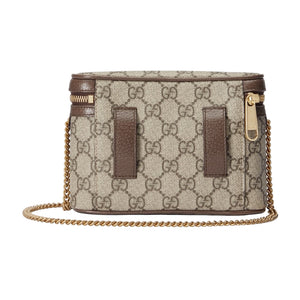Designer handbag with chain strap on a light gray background