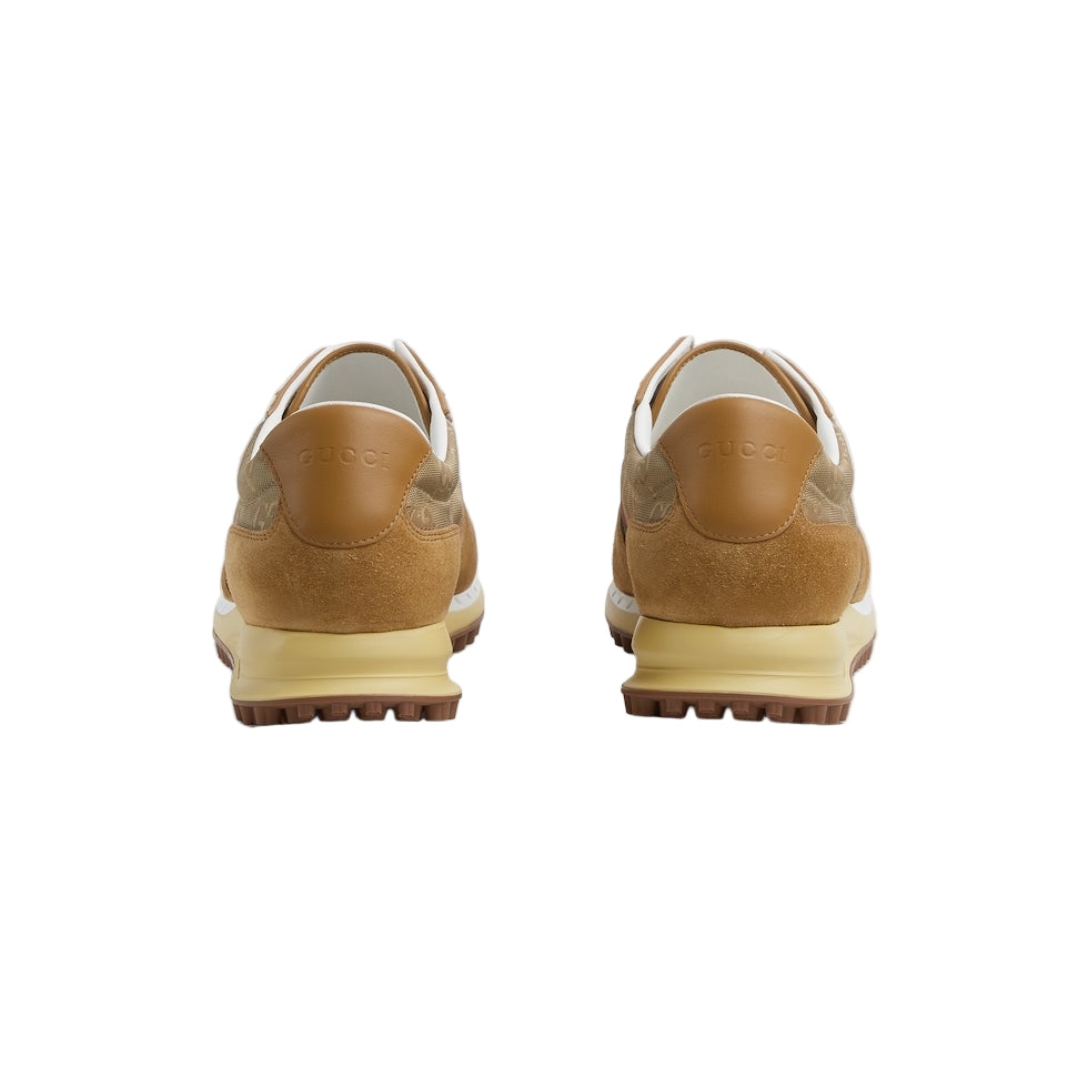 Pair of tan sneakers on a light gray background