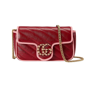 Red handbag with gold chain strap on a light gray background