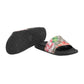 Floral slide sandal with black sole on a light gray background