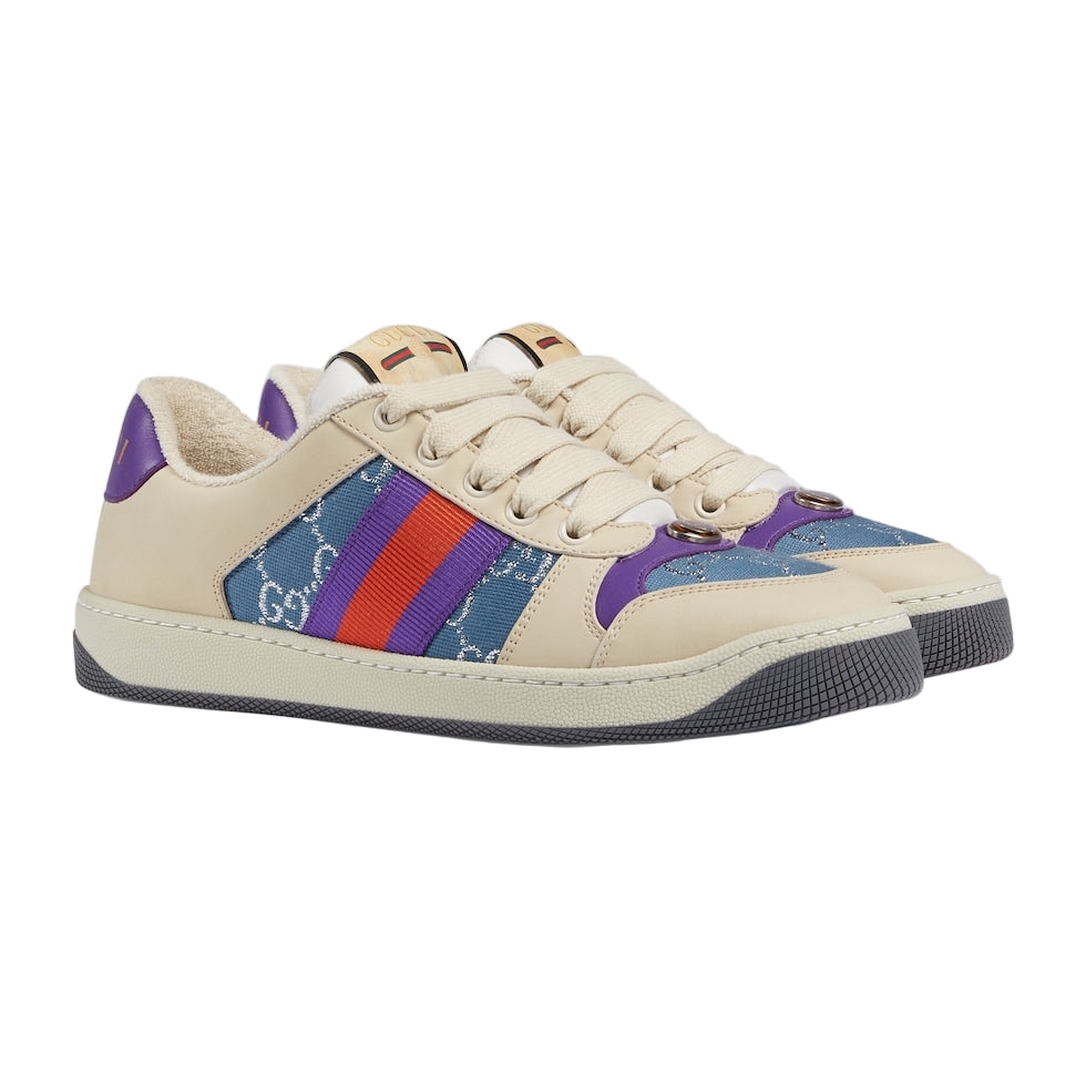 Beige sneaker with colorful stripes on a light gray background
