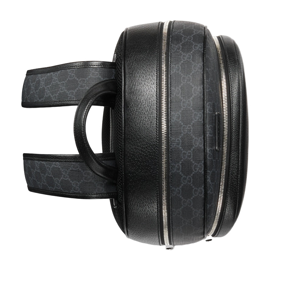Black patterned backpack on a light gray background