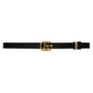 Black belt with gold Gucci logo buckle on a white background