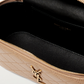 Saint Laurent vanity leather shoulder bag with open zipper showing interior.