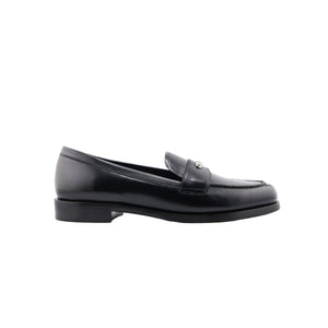 Black Prada loafer shoe on a white background
