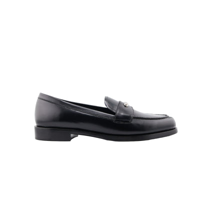 Black Prada loafer shoe on a white background