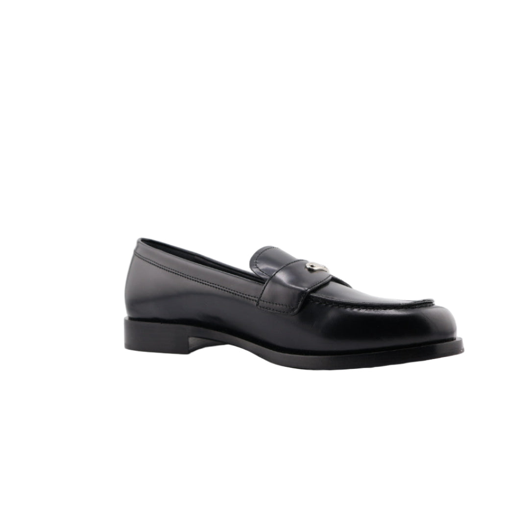 Black loafers on a white background