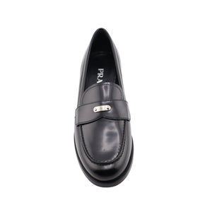Black loafer shoe on a white background