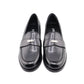 Pair of black loafers on a white background