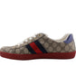Sneaker with Gucci logo and color stripes on a white background