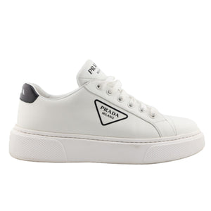 White sneaker with Prada logo on a white background