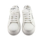 White sneakers with Prada logo on a white background