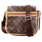 Designer handbag with monogram pattern on a white background