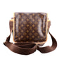 Brown LV  leather bag with a prominent pattern on a white background