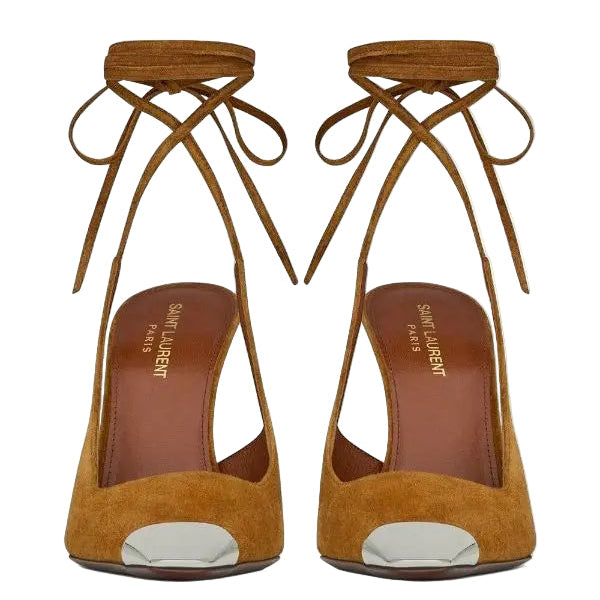 Pair of mustard yellow suede high heels with tie-up design on a white background