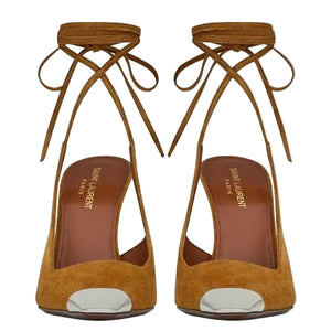 Pair of mustard yellow suede high heels with tie-up design on a white background