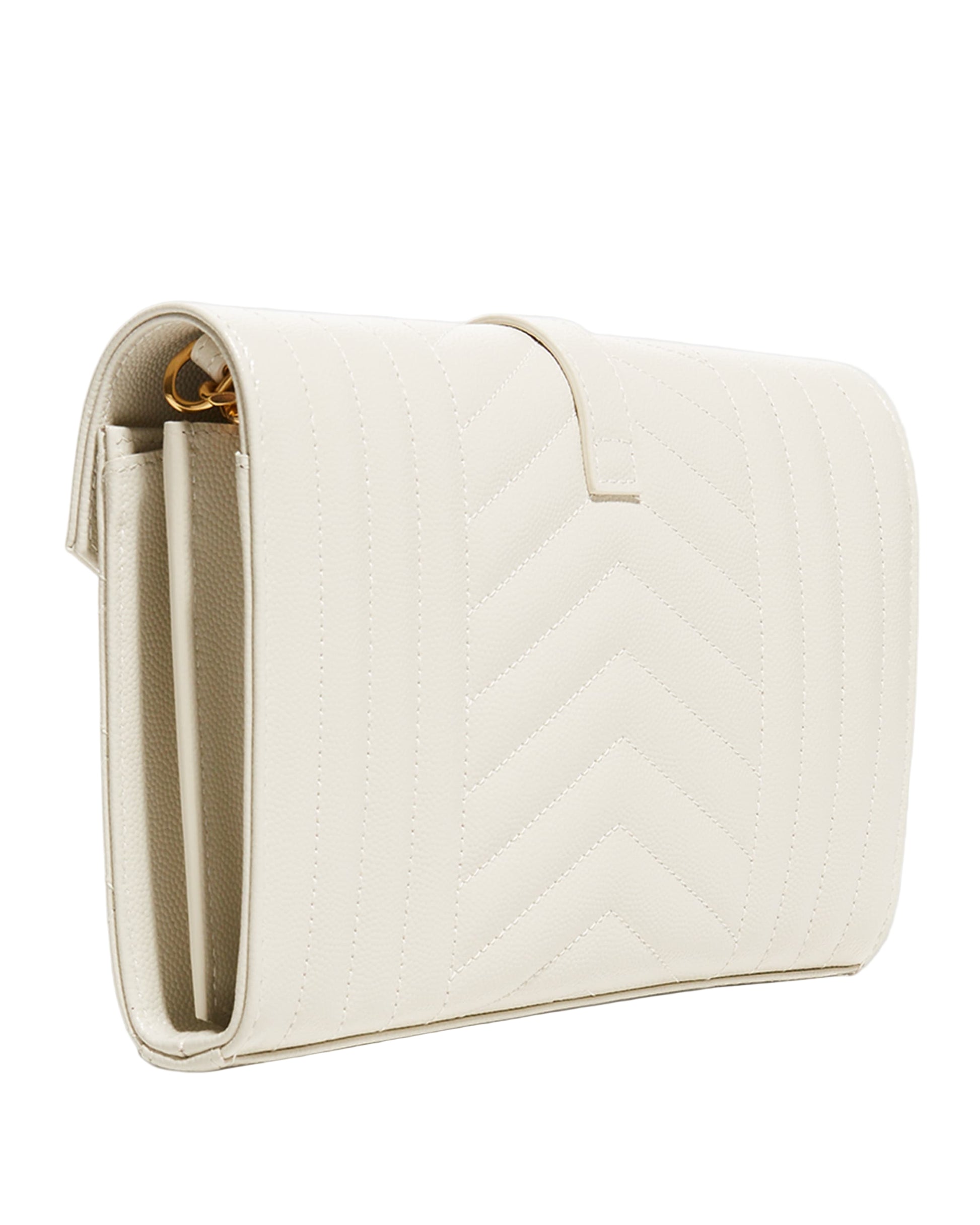 White quilted clutch bag on a light gray background