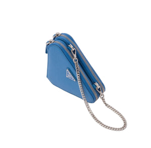 Blue handbag with a chain strap on a light gray background
