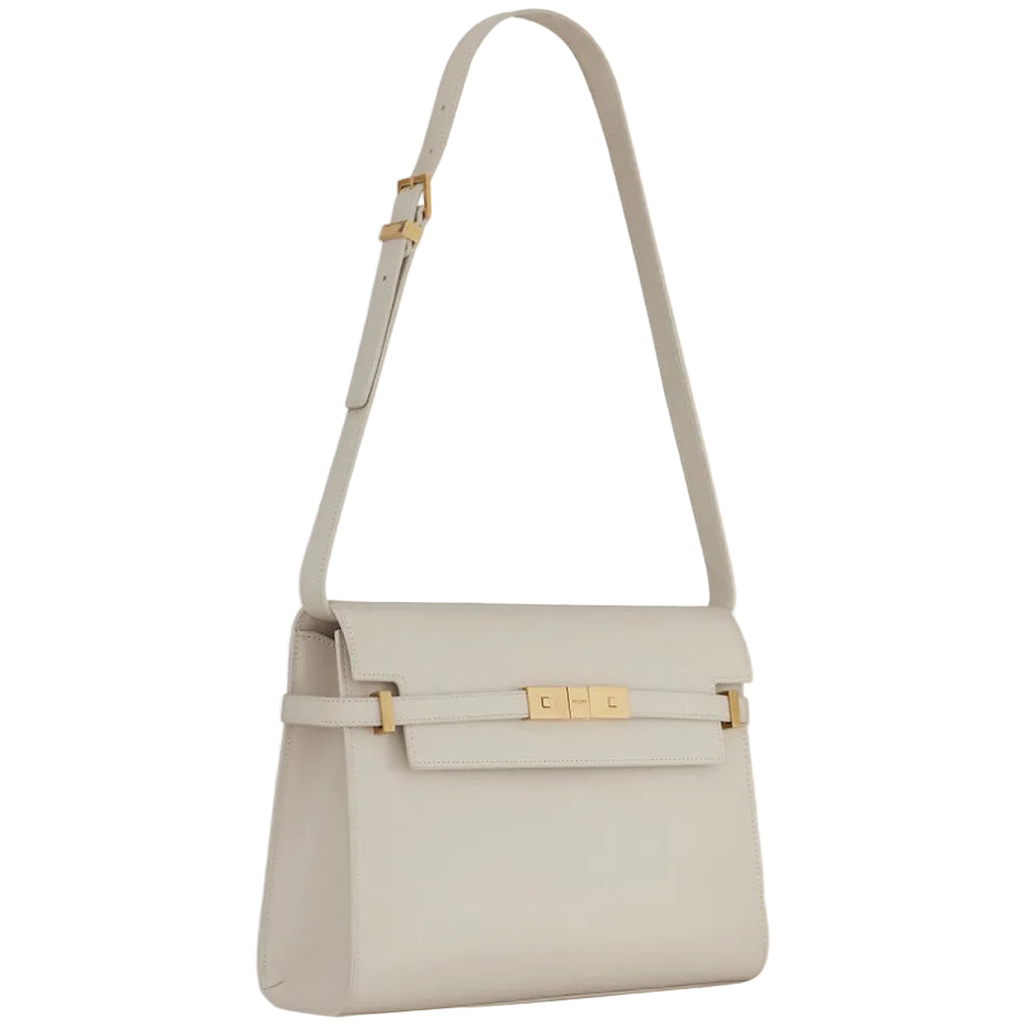 Light gray handbag with gold accents on a light gray background