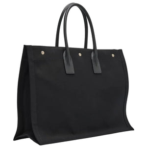 Black tote bag with leather handles on a light gray background