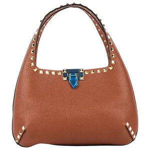 Brown handbag with studded details on a white background