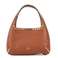 Brown handbag with gold studs on a white background