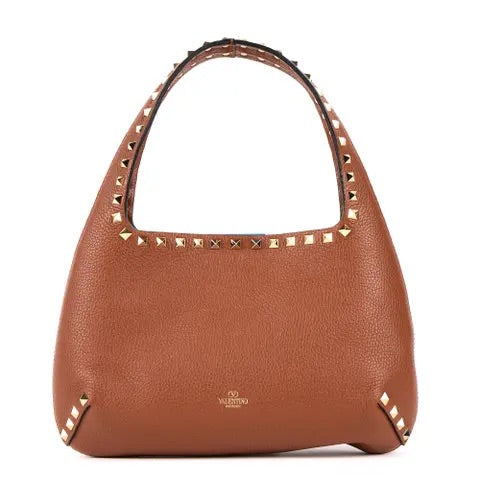 Brown handbag with gold studs on a white background